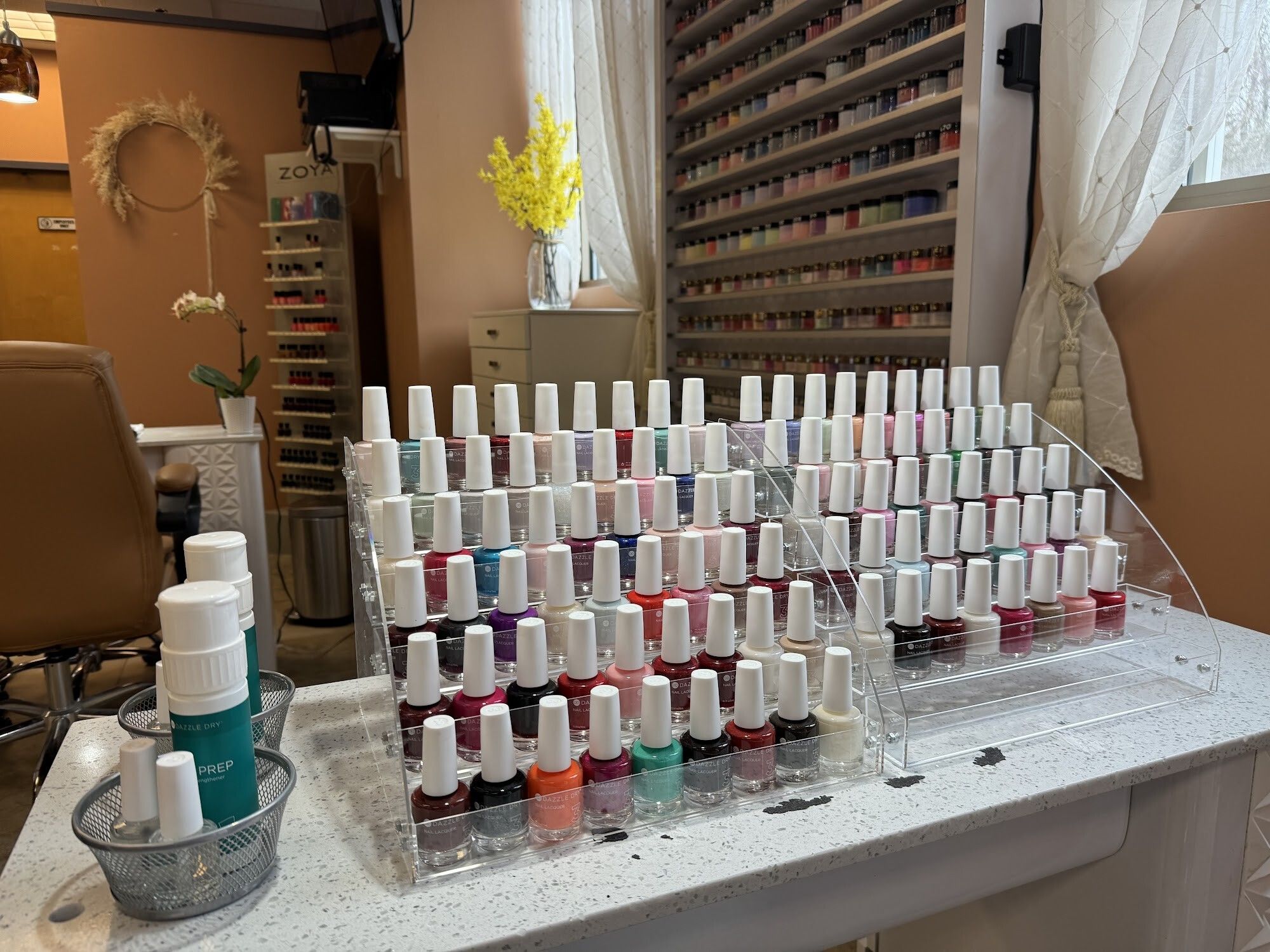 Gel polish station by the window with fresh flowers